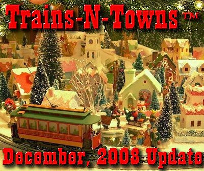 The official e-newsletter of Big Indoor Trains<sup><small>TM</small></sup> and Big Christmas Trains<sup><small>TM</small></sup>. This is author and designer Howard Lamey's Christmas village for 2008 - it's around the Christmas tree this year instead of on its own table. Howard made all of the houses you can see - check out our Glitterhouse page for examples.  Click for bigger photo. 